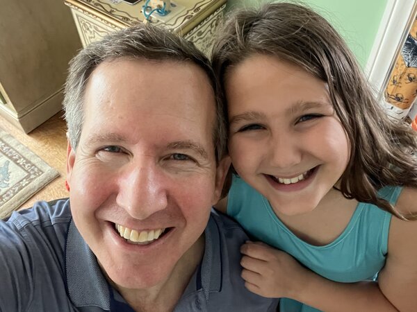 Dana and Georgia Glazer looking up at the camera with big smiles